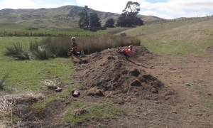 Kids Jumping Trikes Over Dirt Jump