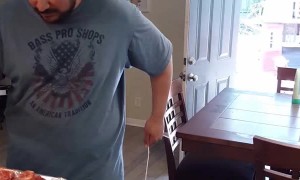 Dad Seasons Dinner While Entertaining Toddler