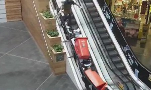 Man Makes a Huge Paper Mess Going Up Escalator