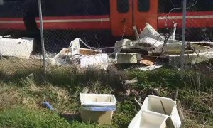 Train Trashes Boat Off Transporting Truck