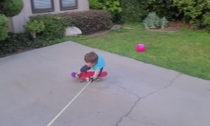 Father Helps Son Skateboard at Home During Quarantine