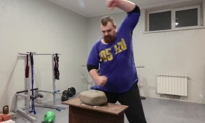Russian Man Demonstrates Big Stone Hand Training