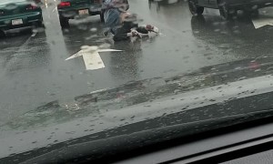 Brawl in the Rain at an Intersection