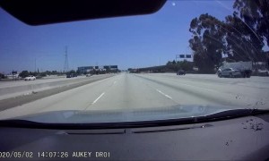 Car Swerves Straight Into the Side of a Dump Truck