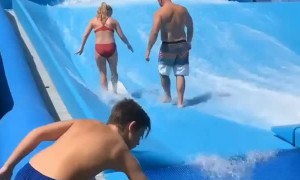 Guy Loses Balance on Wave Machine
