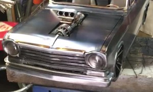 Man Beautifully Crafts Small 3D Metal Car