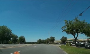 Out of Control Car Reverses Into Car Park