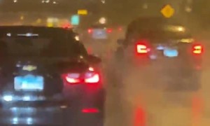 Car Speeds Down the Expressway with its Hood Up