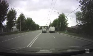 Van Swerves Into and Snaps Power Pole