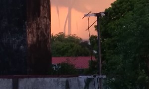 Multiple Waterspouts Wind Down From Sky During Storm