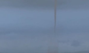 Waterspout Funnels Fill Horizon During Storm