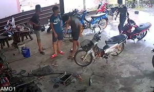 Moped Crashes into Garage