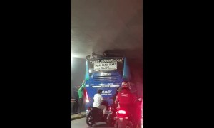 Boys Extracted from Bus Top in Tight Underpass