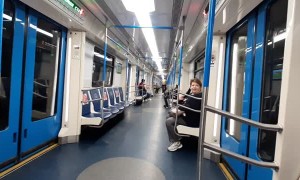 Guy Rides Bicycle in Metro Train