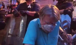 Frail Man Takes a Knee on the Front Lines of Protest