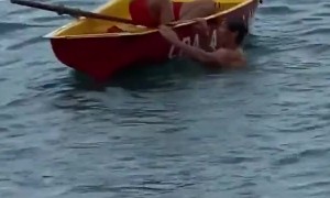 Rescuers Take Turns Going Overboard