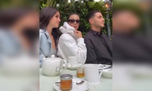 What is Kourtney doing with her?