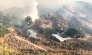 Water-dropping helicopters fight to put out Soledad Fire in California