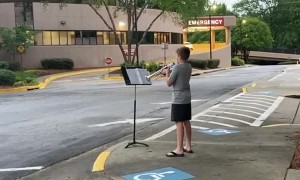 12-year-old boy plays trumpet for healthcare workers