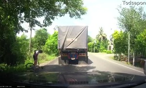 Speed Hump Nearly Sends Cyclist Under Truck