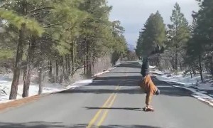 Man Handstands on Longboard down Grand Canyon Roadway