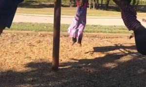 Large Group of Kids Spinning around on Playground Equipment