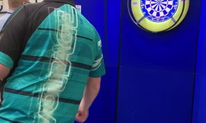 Boy Plays Darts with Professional Player Rob Cross