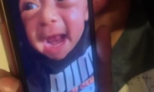 Baby in shock as he watches a video of himself crying