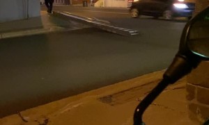 Strange Way to Transport Ladder Down Street