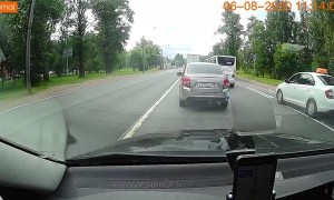 Close Call as Woman Falls While Crossing Street