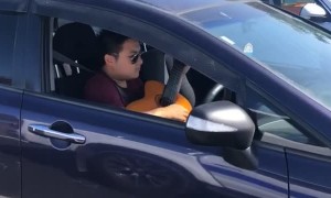 Musician Multitasks on Auckland Motorway