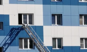 Rescuers Save Child from Falling from Open Window