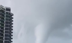 Waterspout-turned-tornado sweeps coast as thunderstorms pound South Florida