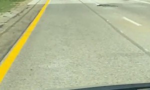 Over-Sized Load Sends Construction Cones Flying