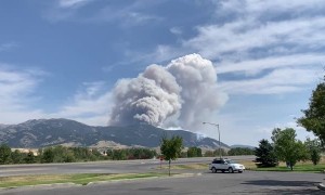 Plane Drops Fire Retardant to Control Montana Wildfire