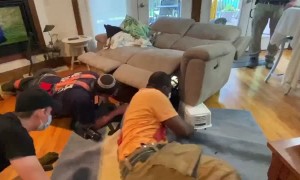 Firefighters Rescue Dog Trapped in Recliner