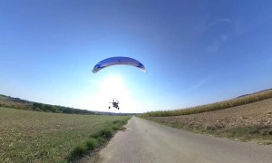 Paramotor Operator Surprises Mountain Board Rider in French Landscape