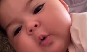 Sweet baby becomes super adorable for the camera