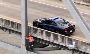 Engineer saves dog on bridge 120 feet over Mississippi River