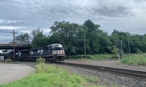 Happy Train Engineer Throws Gift to Railfan