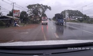 Truck Carrying Big Load Has Close Call on Slippery Road