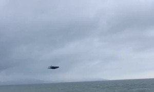 Eagle Flies Alongside Driver in Alaska