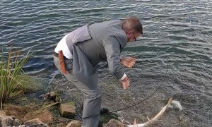 Man Catches Fish Moments Before Wedding