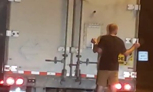 Man Clings to the Back of 18-Wheeler on Freeway