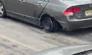 Car Drives Along Interstate on the Rim