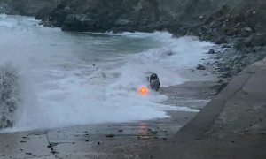 Large Waves Swallow SUV Stuck on Beach