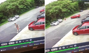Guy doesn't park his car correctly, ends up chasing it across the parking lot