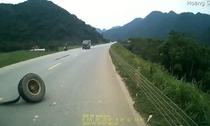 Truck Loses Tire on Curving Road