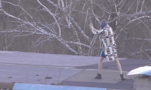 Man Practices His Martial Arts Skills on Rooftop