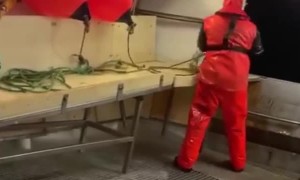 Rough Waves Wash Over Fishing Boat Crew